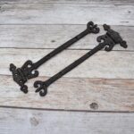 Pair of Ornate Fleur-de-Lis End Black Wrought Iron Strap Hinges