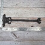 Pair of Ornate Fleur-de-Lis End Black Wrought Iron Strap Hinges